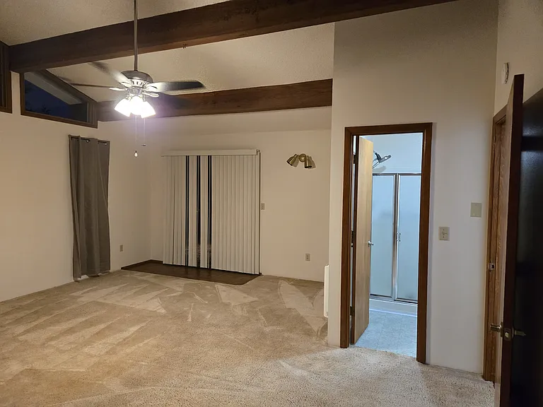 Primary Bedroom with bathroom and patio access