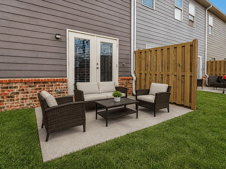 Private outdoor patio with comfortable seatingperfect for relaxing, dining, or enjoying the fresh air.