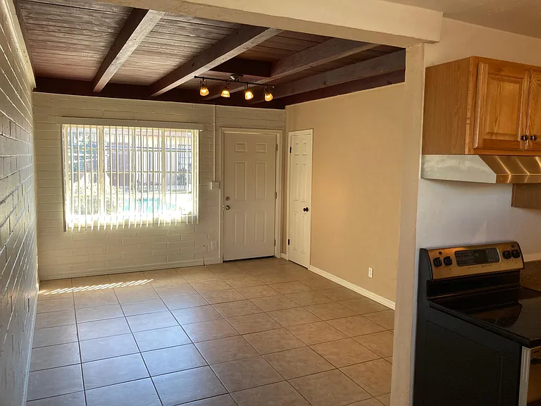 front door with adjacent coat closet