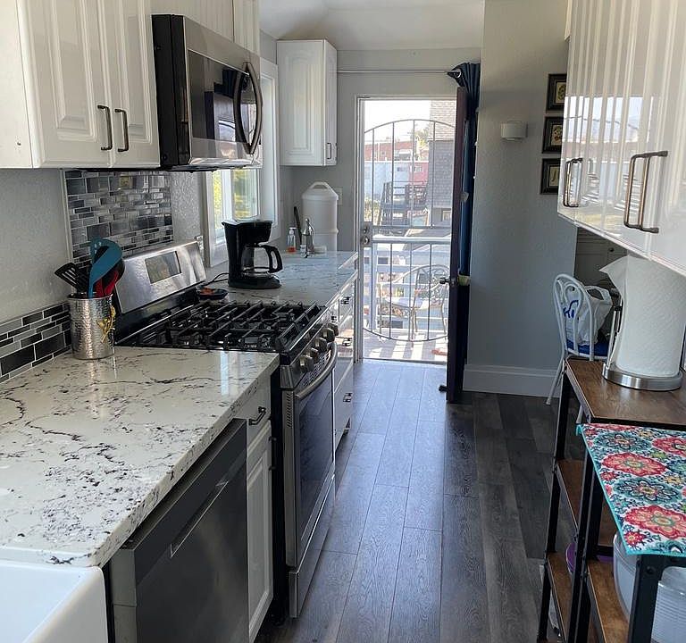 Kitchen with door leading to backyard