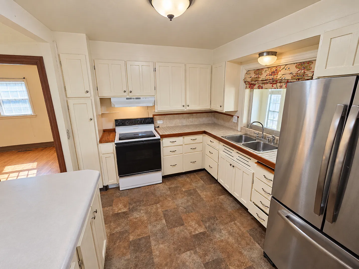 Spacious 3-Bedroom Home with Classic Charm, Sunroom & Private Backyard — Photo 3