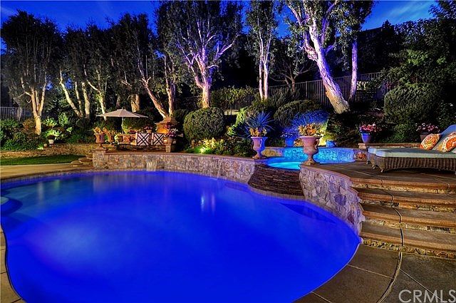 Amazing Resort Style Grounds include Saltwater Pebble Tec Pool with Natural Montana Stacked Stone & 2 Sheer Decent Waterfalls + 