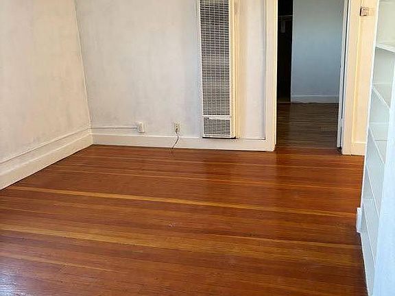 Living room with wall heater to 1st Bedroom