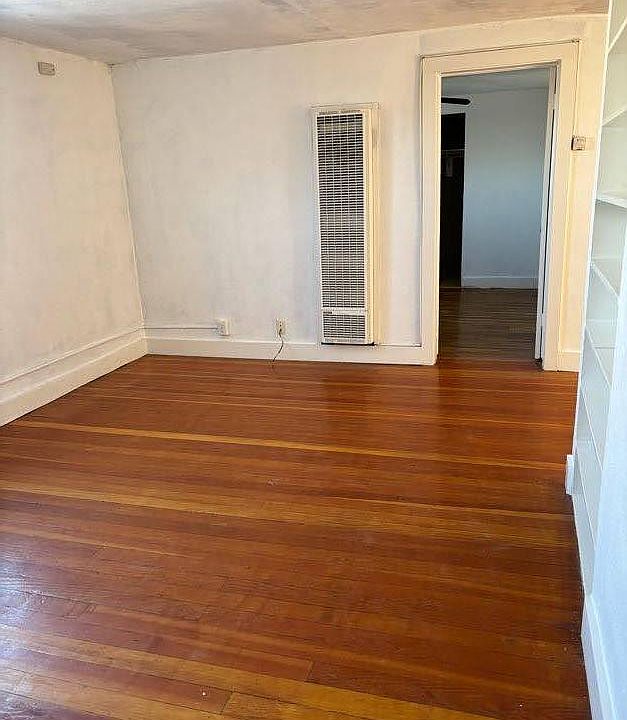 Living room with wall heater to 1st Bedroom