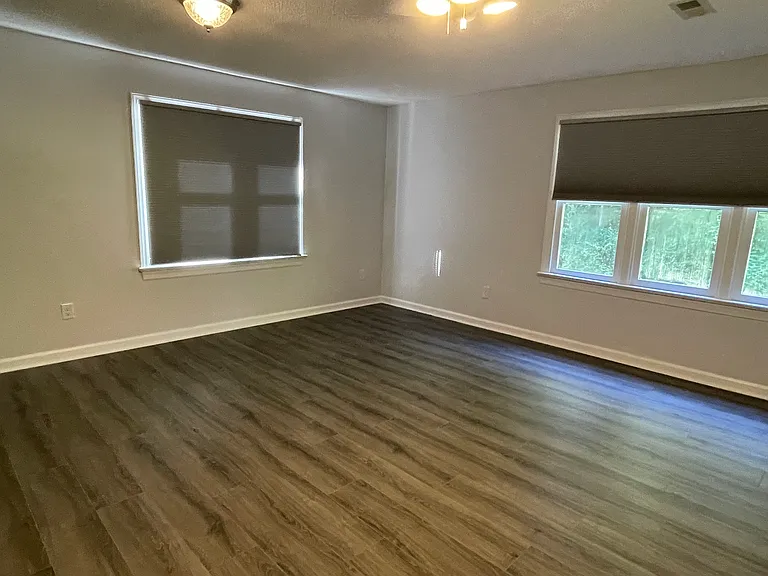 Very large bedroom. Custom window shades included.