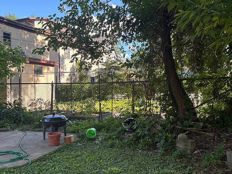 Backyard with space to have friends over from time to time. Raspberries should be ready in July!