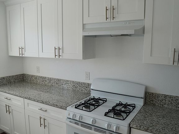 Kitchen with newer cabinets, countertops