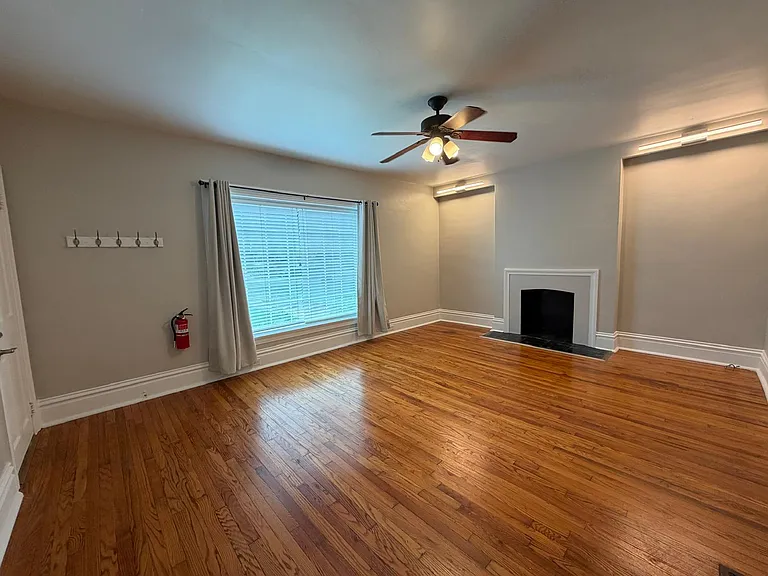 Living room with large window, gets direct sunlight during the day