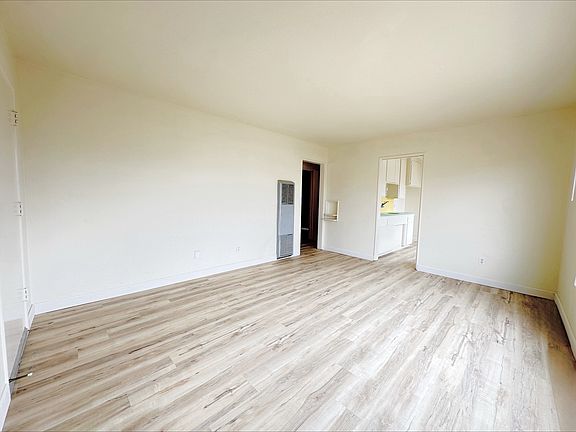 Brand new Linoleum Vinyl Plank Flooring complimented by lots of natural lighting a large front window!