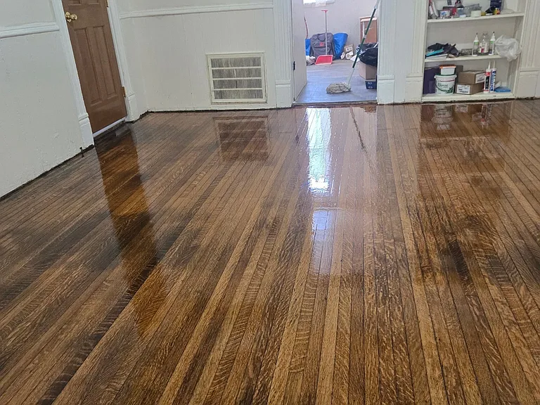 Dining room to Kitchen, door to bathroom, thermostat, bookshelf, furnace filter vent.