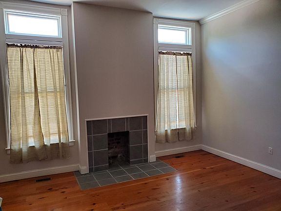 First floor middle parlor adjoins the front parlor creating a large open space that can be subdivided.