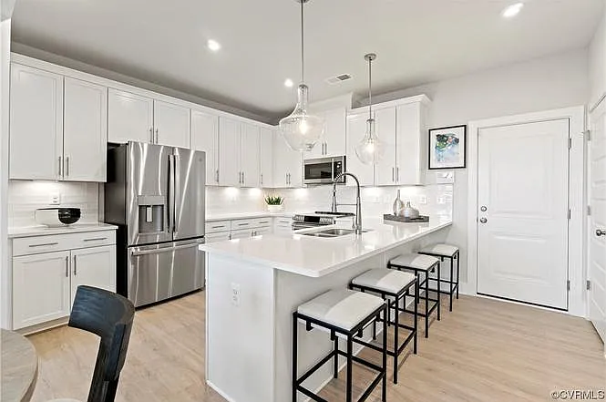 Some photos include stock images of an identical model home. Actual unit finishes, views, and colors may differ.