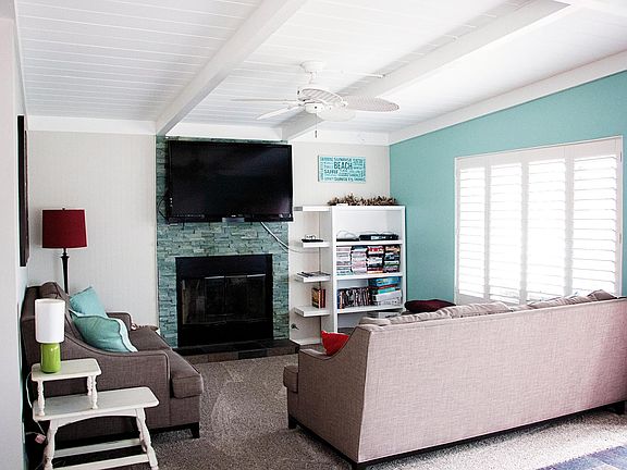 Living room with big windows to let in the beach breeze!