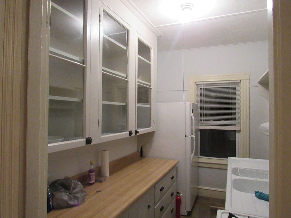 Kitchen with New Stove and Refrigerator, Glass Cabinets, two