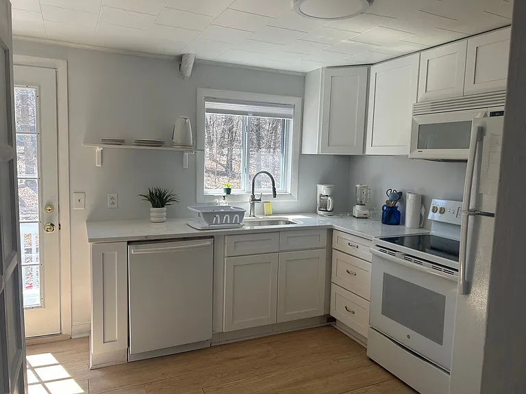 Kitchen with coffee maker, blender dishes etc