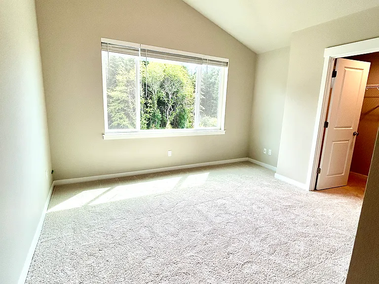 Secondary bedroom w/ vaulted ceiling