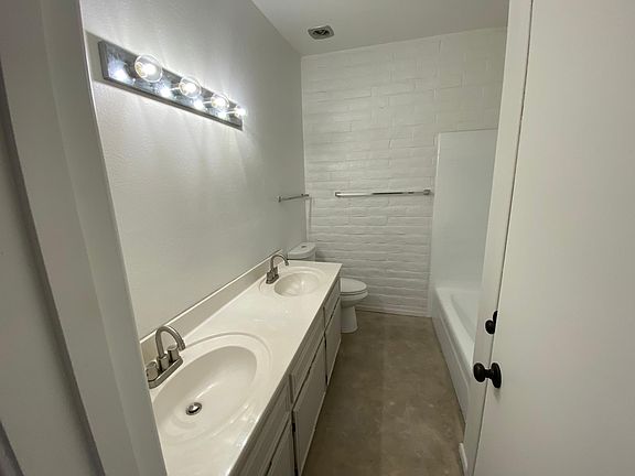 Bathroom #1 - double sink, tub/shower, linen closet