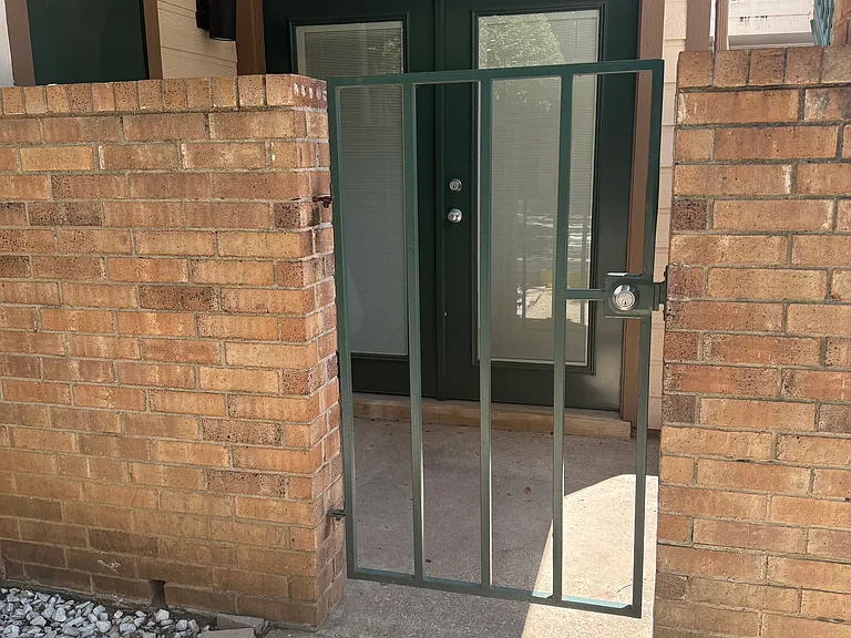 Patio and entryway with outside storage closet.
