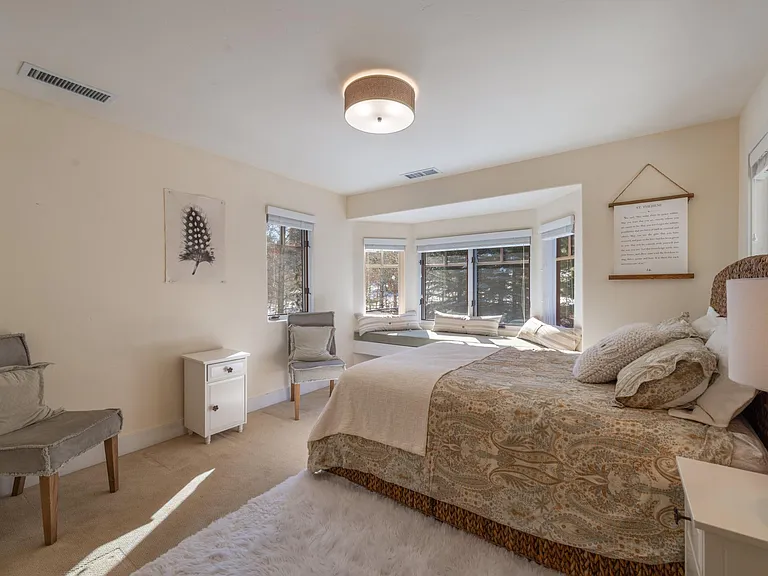 This bedroom features an en suite bathroom with tiled shower
