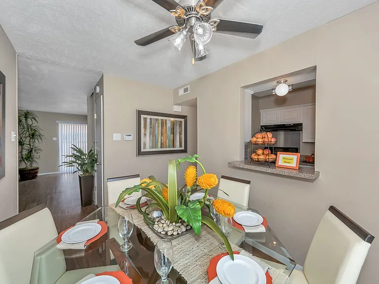 Dining area with open layout connecting to kitchen and living room