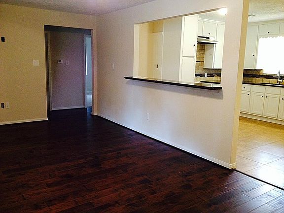 As you enter the home, you can appreciate the open concept design with a granite topped bar leading 