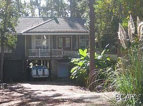 Front of Home Paved Driveway with Covered Parking