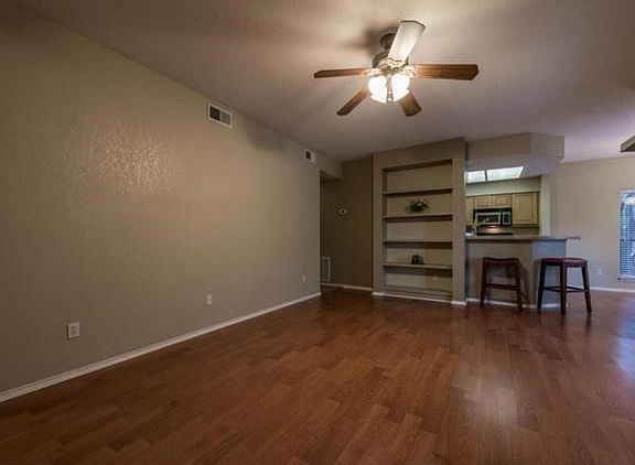 The main living space is painted a neutral color and ready for you to move right in! The long wall provides the perfect space for a couch long enough to stretch out on for a Sunday nap!