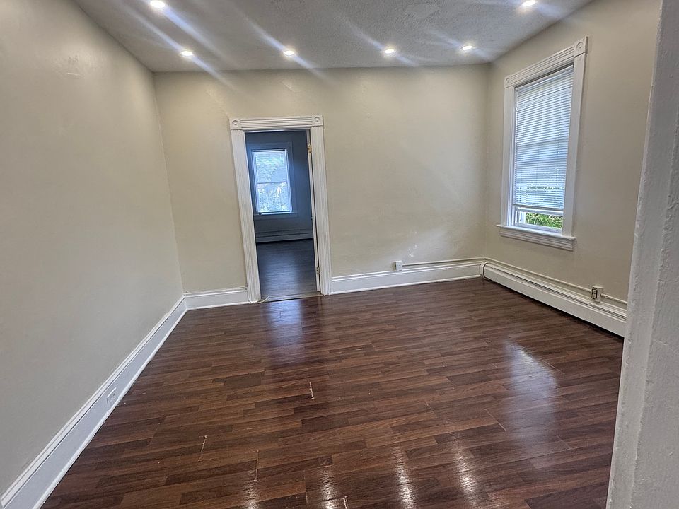 Spacious living room with high ceilings and lots of natural sunlight