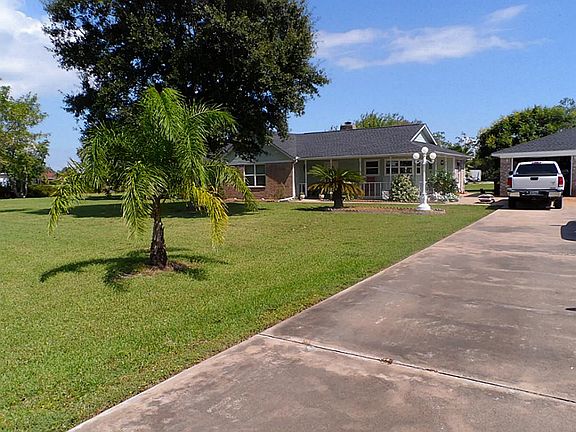 Double wide driveway with a detached garage