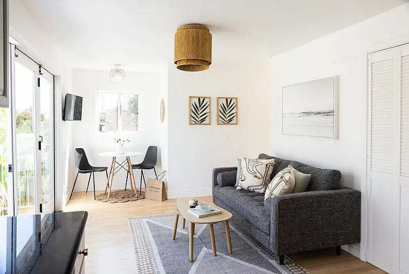 Living room opens up to a private upstairs balcony - 1125 De La Vina St #I