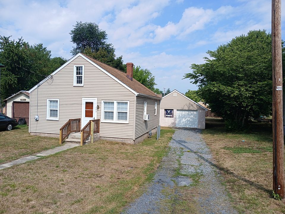 house & garage..storage door entrance is to the left of garage door (not in pic view)