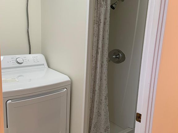 1448B Middletown Road 
Kitchen Entrance into First Floor Laundry with Toilet, Shower, Washer/Dryer