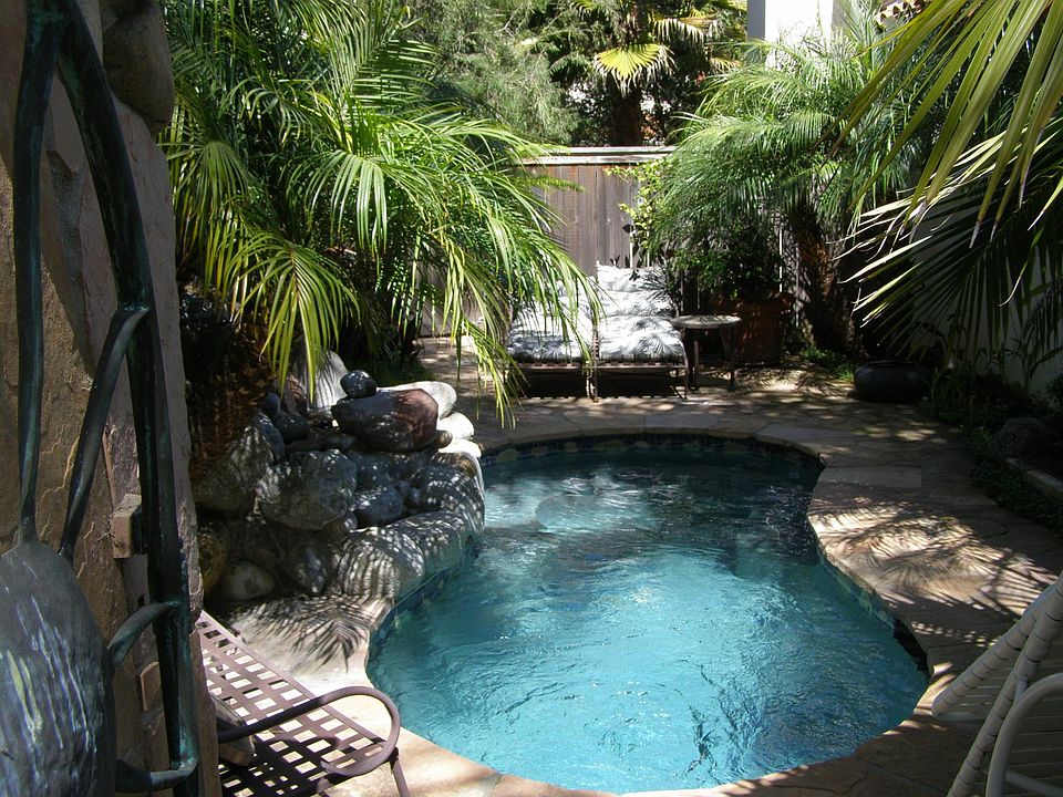 Jacuzzi pool with waterfall - operates on it's own.