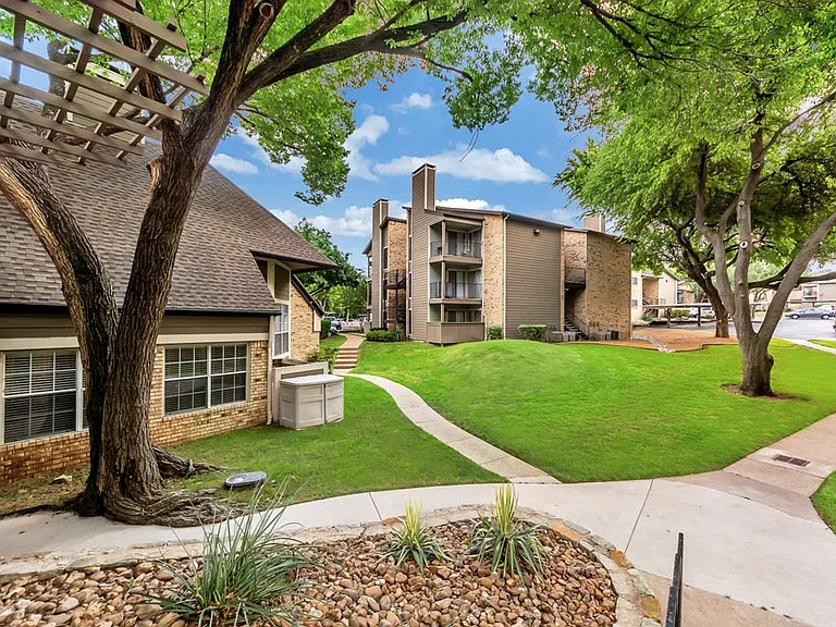 Landscaped courtyard with seating and community pathways