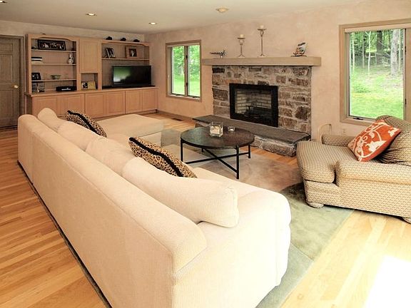 Family Room with Stone Fireplace and
        Built-ins