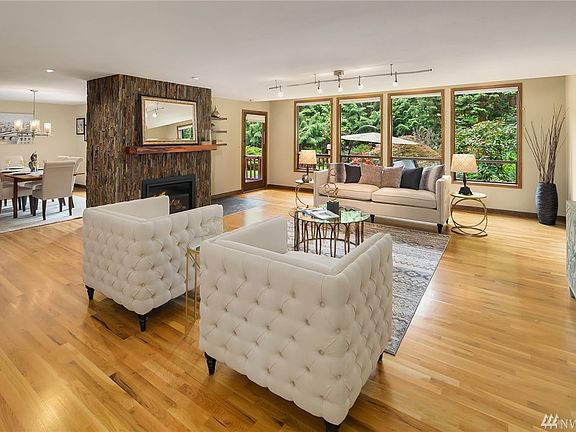 Custom stone fireplace and wood mantle look fabulous!