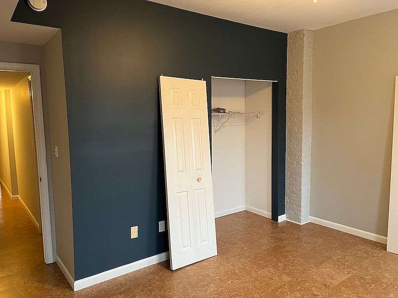 large bedroom after carpet replacment (door going back on)