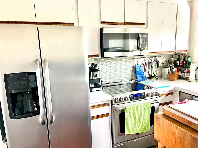 Side-by-side refrigerator, GE, cafe, cooktop, and oven, microwave