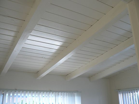 Wood beam ceilings in bedrooms