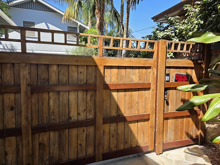 Driveway entrance through security gate.