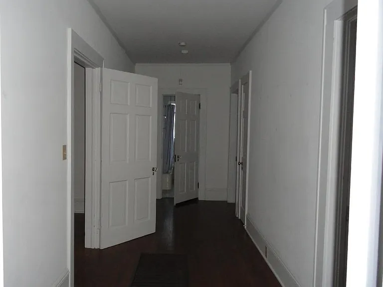 Hallway leading to bathroom and bedrooms. Cold use for small office space.