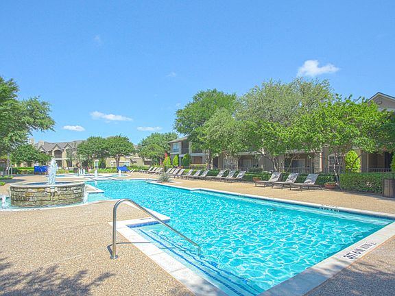 Take a dip in the stunning resort-style pool with tanning lounge chairs