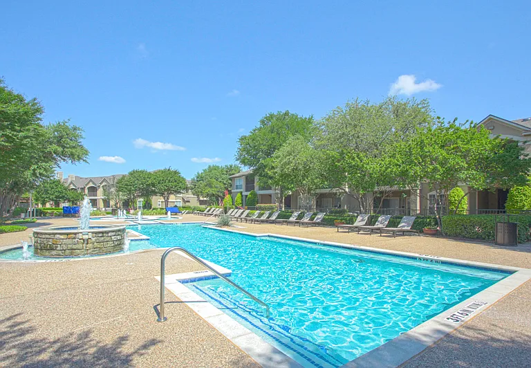 Take a dip in the stunning resort-style pool with tanning lounge chairs