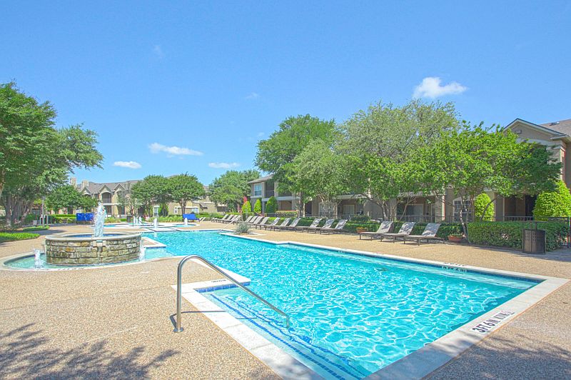 Take a dip in the stunning resort-style pool with tanning lounge chairs