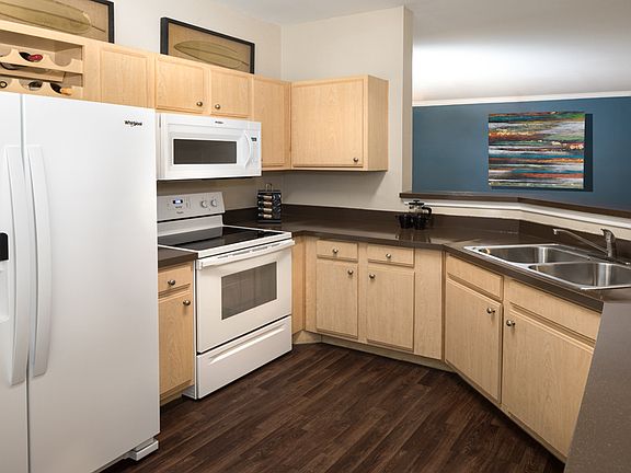 Contemporary kitchens with ample cabinet storage and wine shelf