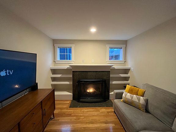 Gas fireplace and built in shelves.