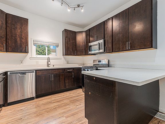 Kitchen offers plenty of cabinets and counter space along with stainless steel appliances!
