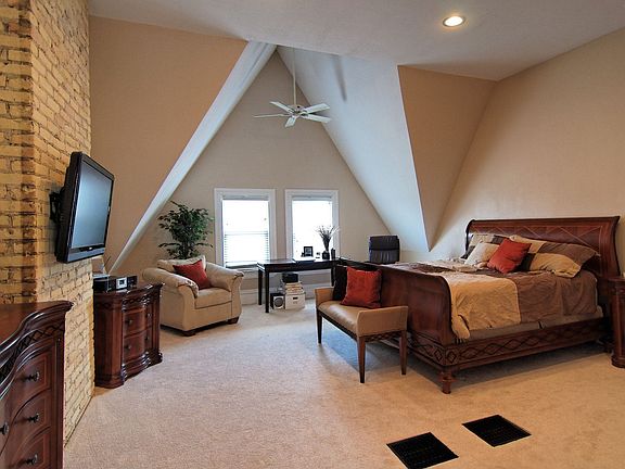 Master Suite with 16 ft cathedral ceilings and private walk-out deck