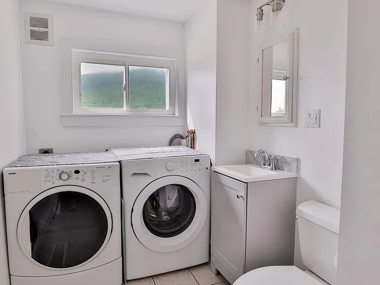1/2 bath and laundry (off kitchen). 1st / main floor washer and dryer.