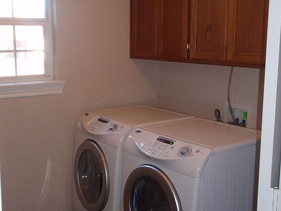 Spacious laundry with room to hang clothes.